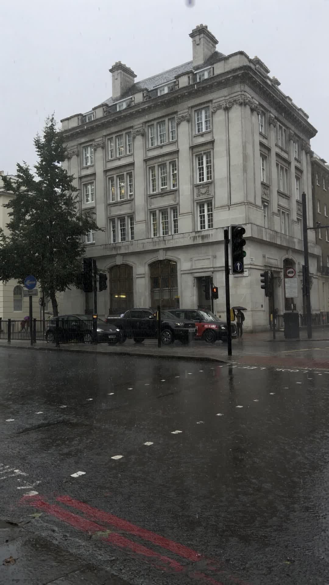 Rainy London Street Corner with Pale Stone Building