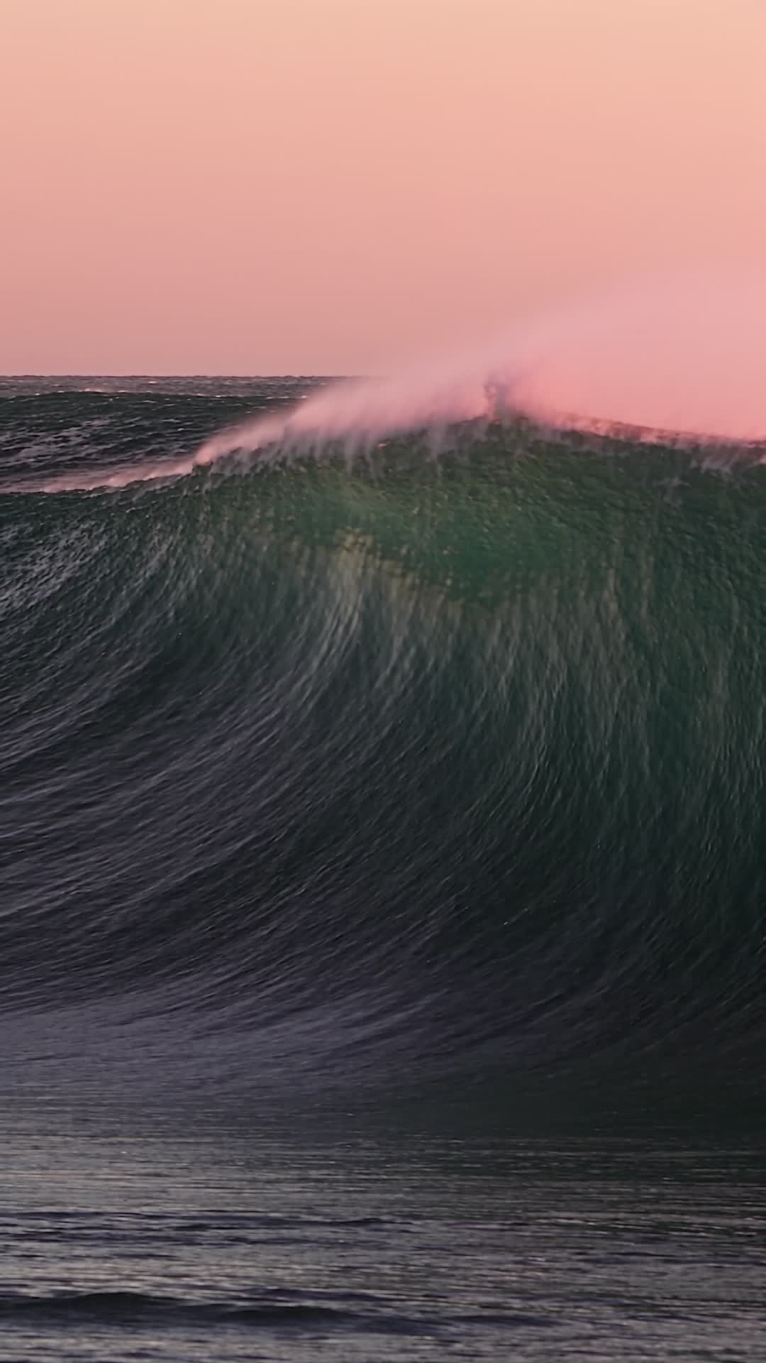 Emerald Green Wave Breaking at Sunrise