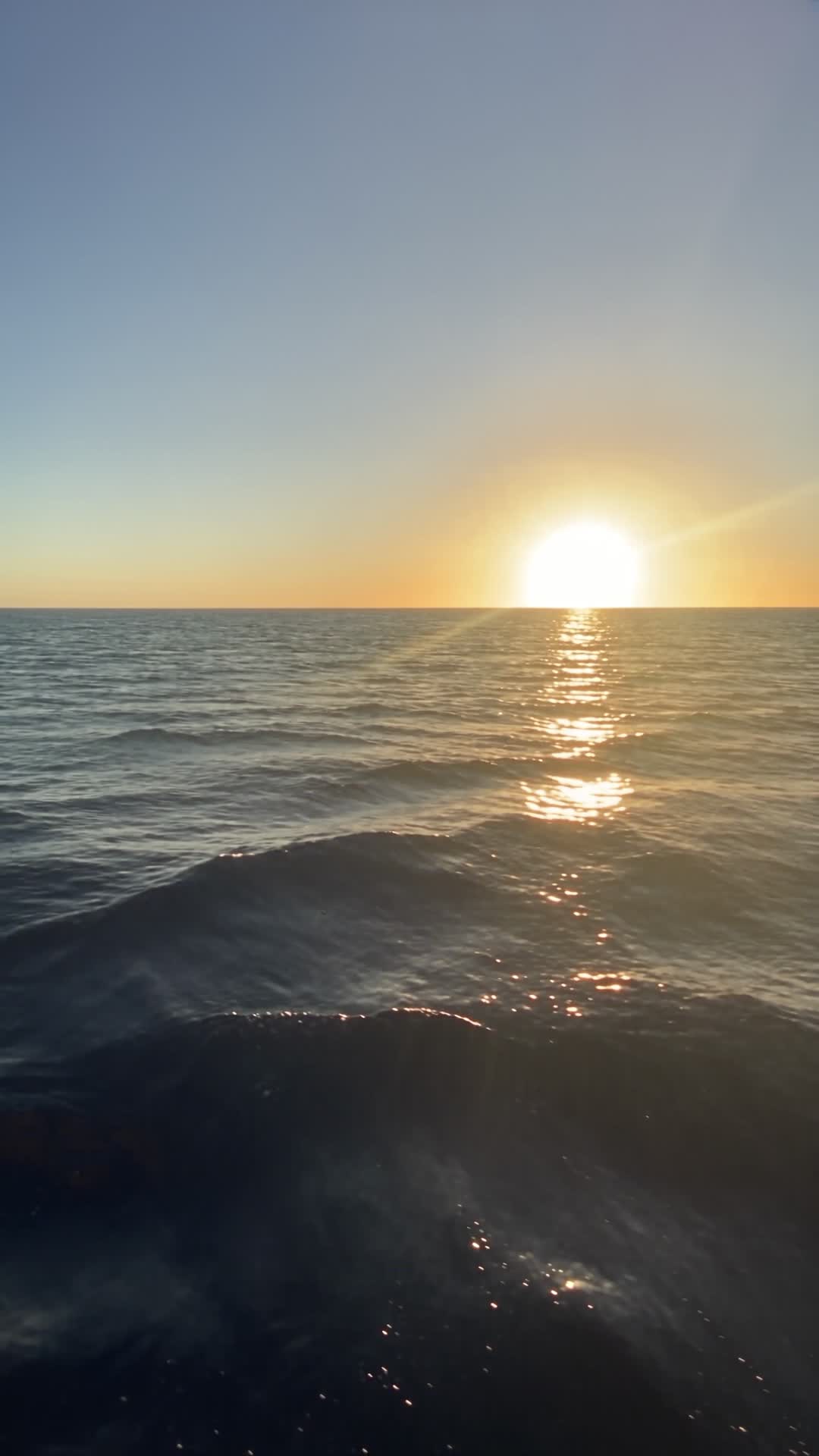 Sunset Over Dark Blue Ocean