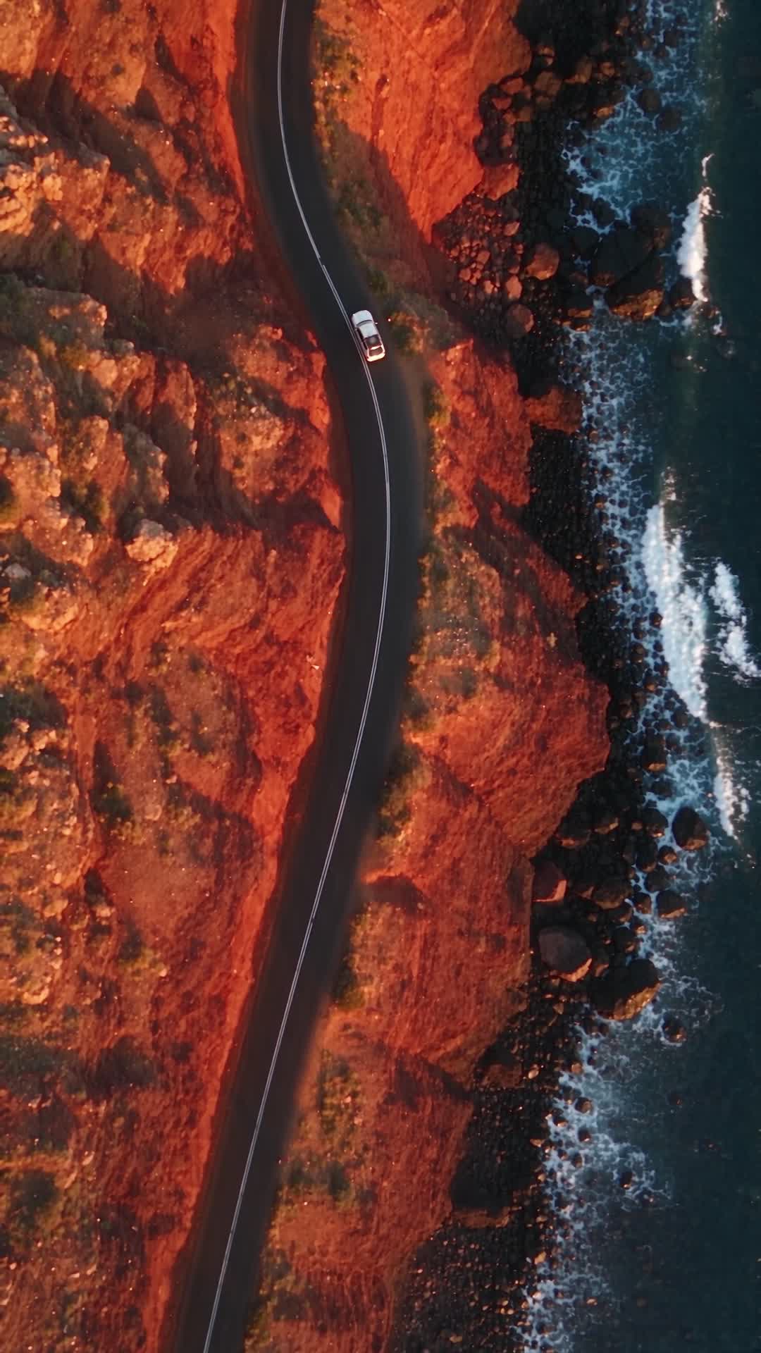 Aerial View of Coastal Road Along Red Cliffs