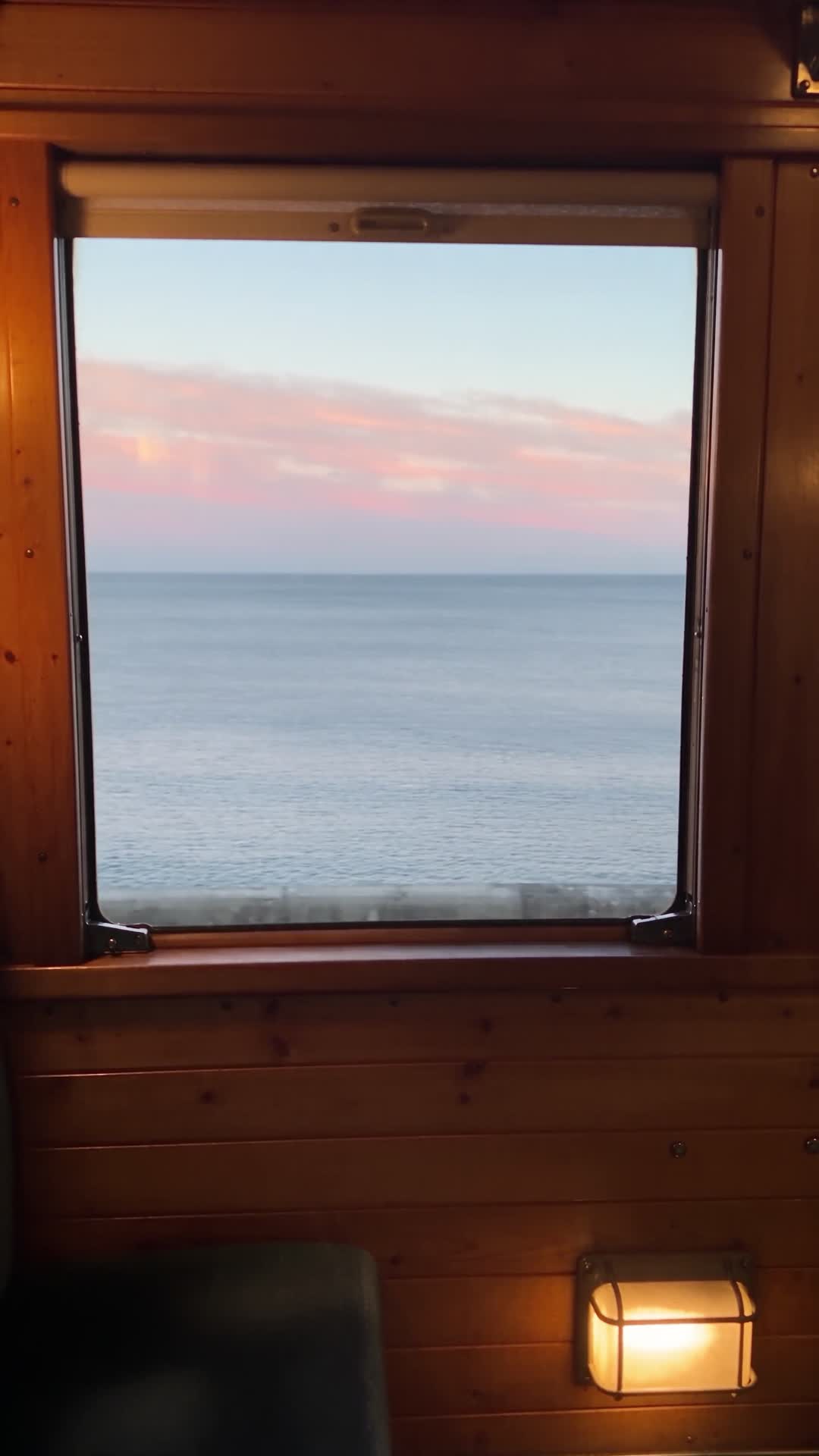 Sea View from Train Window at Dusk