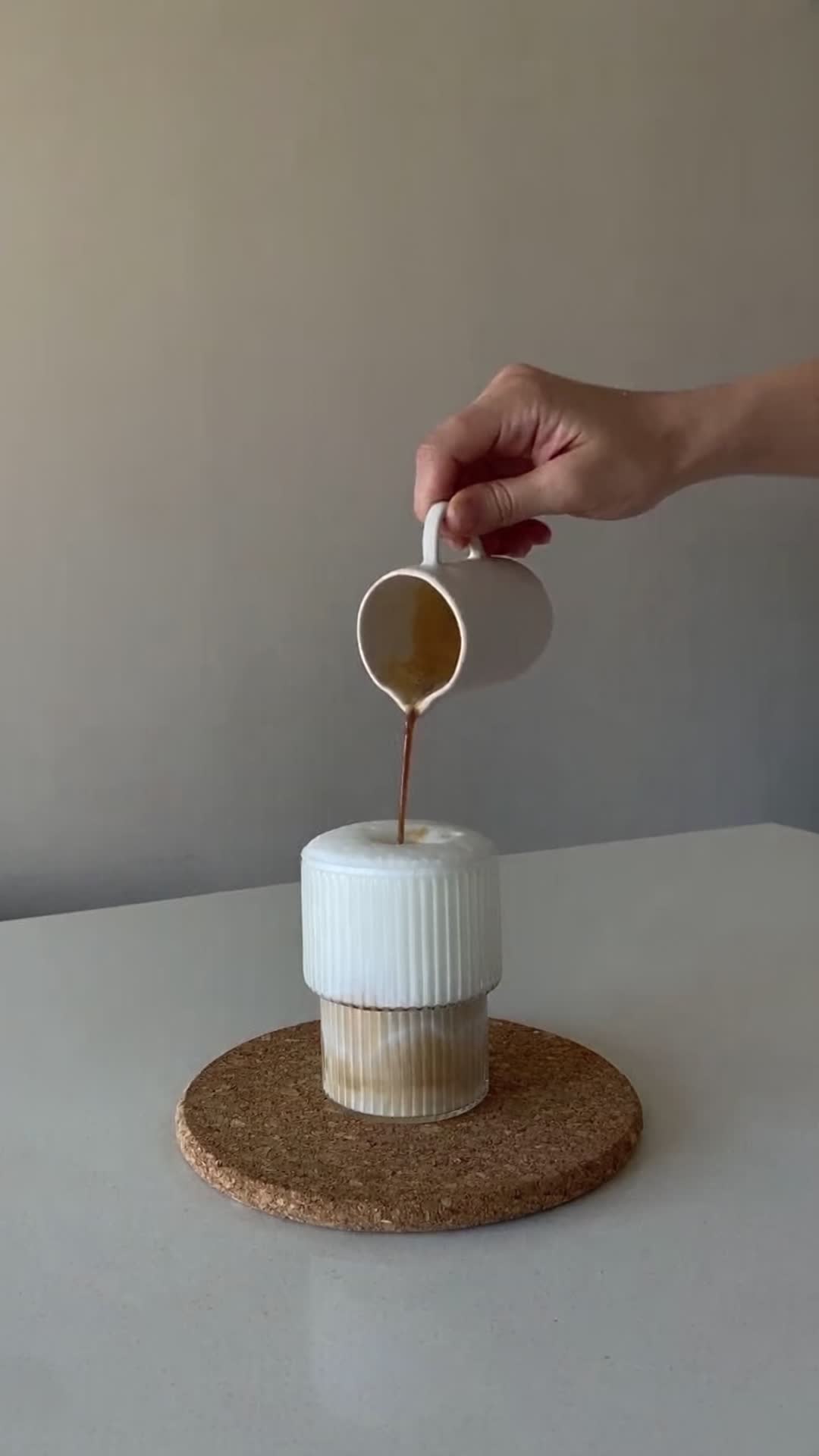 Pouring Coffee into Ribbed Ceramic Cup